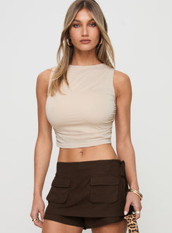 front view of model wearing Princess Polly Hold Em High Neck Top Cream Sleeveless High Neck 