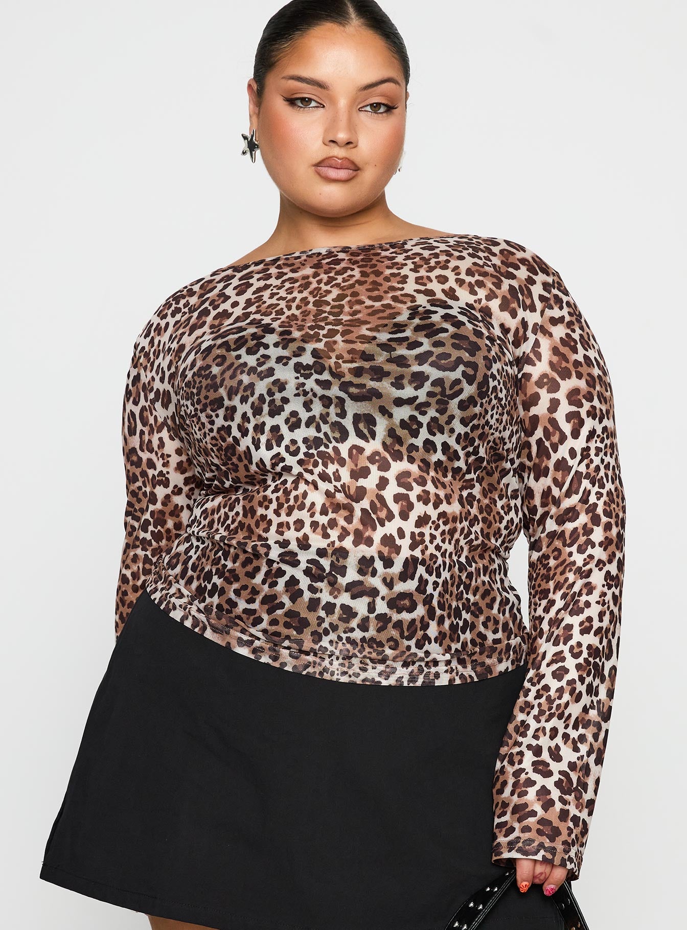 side view of model wearing Princess Polly Believe Me Long Sleeve Top Leopard Curve Full Sleeves Boat Neck 