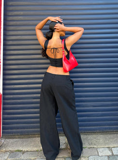 back view of model wearing Princess Polly Unwind Top Black Sleeveless Square Neck 