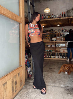 back view of model wearing Princess Polly Jodie Maxi Skirt Black Petite Maxi 