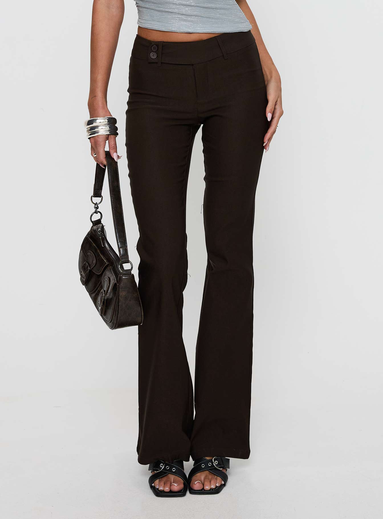 front view of model wearing Princess Polly Kinkirk Flared Pants Chocolate Tall Low Rise Pants 
