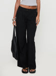 side view of model wearing Princess Polly Sallon Low Rise Pants Black Low Rise Pants 