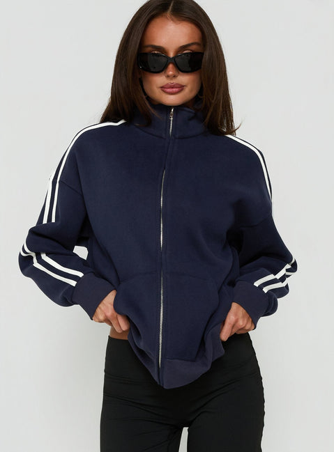 Crafted from fleece, the Keeran Funnel Neck Jumper Navy / White in womens category with short length side view of model wearing Princess Polly
