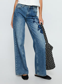 back view of model wearing Princess Polly Sisterhood Mid Rise Wide Leg Patchwork Jeans Mid Blue Wash Mid Rise Jeans 