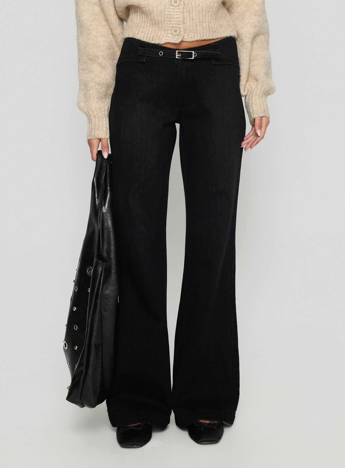 side view of model wearing Princess Polly Slow Ride Mid Rise Bootleg Belted Jeans Washed Black Mid Rise Jeans 