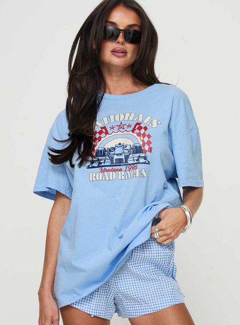 back view of model wearing Princess Polly Races 1996 Oversized Tee Blue Half Sleeves Crew Neck 