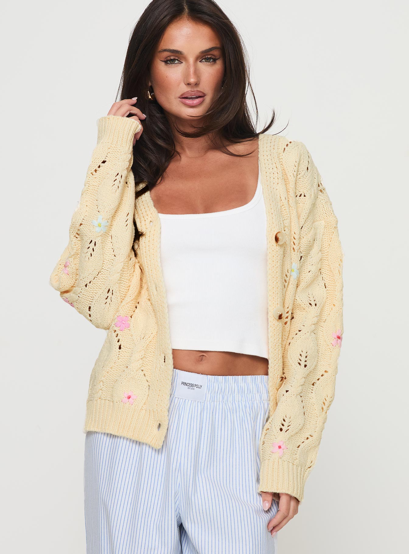 back view of model wearing Princess Polly Daffodil Cardigan Cream Cropped 