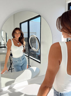 side view of model wearing Princess Polly Rehna Bodysuit White Sleeveless 