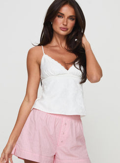 front view of model wearing Princess Polly Astraia Top White Sleeveless Plunger 