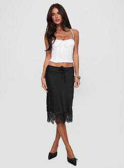   side view of model wearing Princess Polly Gervais Satin Midi Skirt Black Midi Skirts 