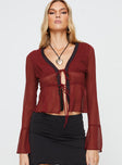 Long sleeve top V neckline, lace trim, twin tie fastening at bust Non-stretch, lined bust Princess Polly Lower Impact