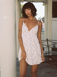 side view of model wearing Princess Polly Koko Mini Dress Cream Floral Petite Plunger 