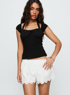 front view of model wearing Princess Polly Danyi Anglaise Shorts White Low Rise Shorts 