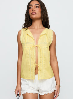 back view of model wearing Princess Polly Angourie Blouse Top Lemon Sleeveless Crew Neck 