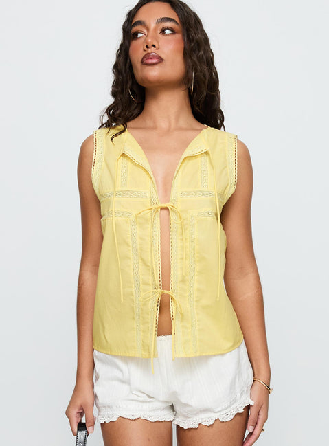 back view of model wearing Princess Polly Angourie Blouse Top Lemon Sleeveless Crew Neck 
