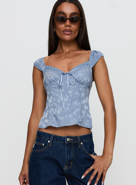 front view of model wearing Princess Polly Branwen Cap Sleeve Tie Detail Top Blue Floral Sleeveless Sweetheart 