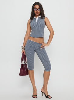 side view of model wearing Princess Polly Tuka Capri Navy Gingham Mid Rise Pants 