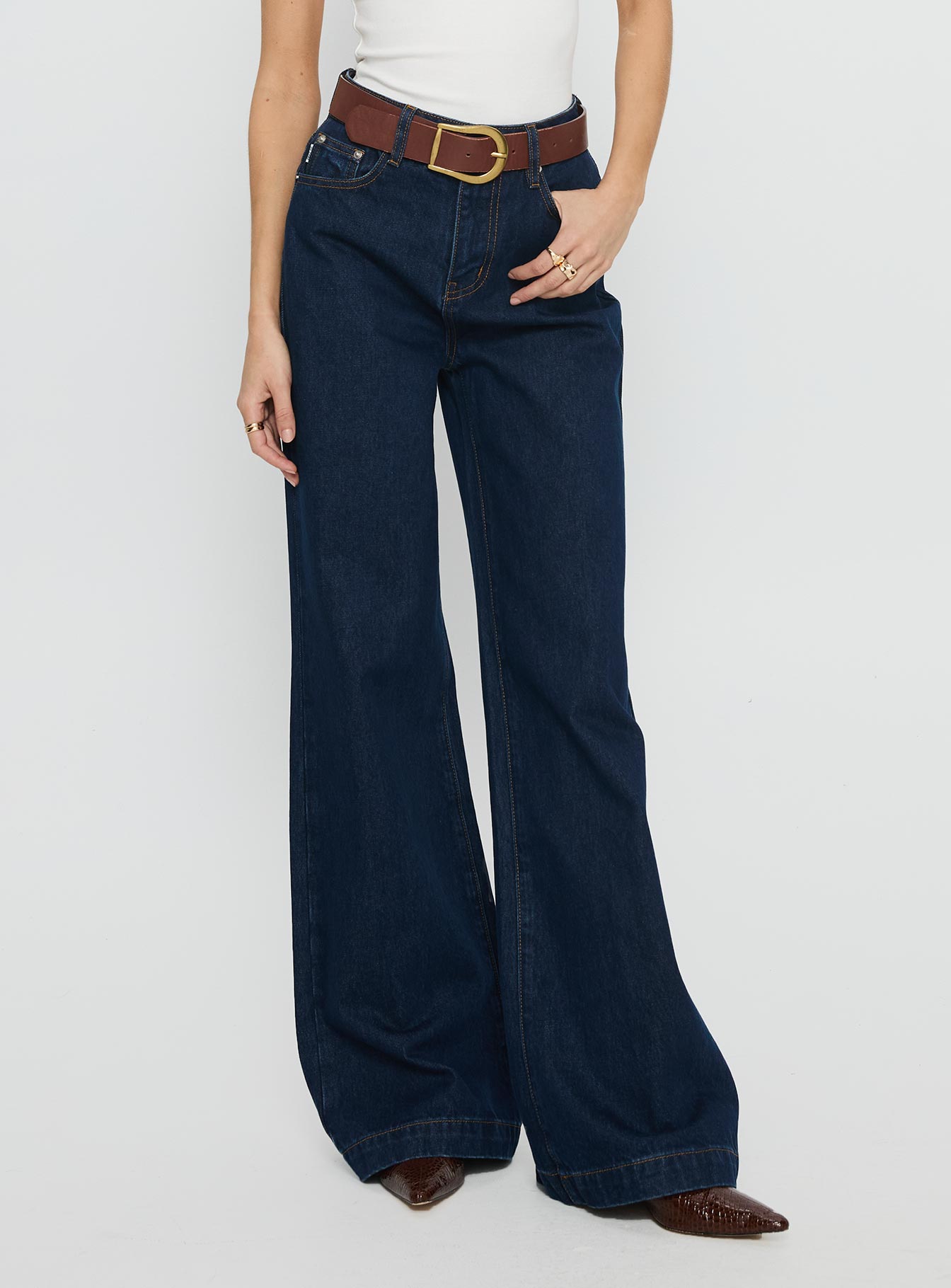 side view of model wearing Princess Polly Goldie High Rise Wide Leg Jeans Indigo High Rise Jeans 