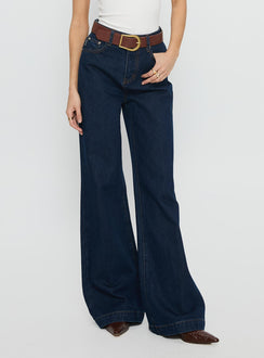 side view of model wearing Princess Polly Goldie High Rise Wide Leg Jeans Indigo High Rise Jeans 