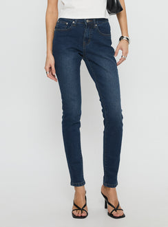 front view of model wearing Princess Polly Illyssa Mid Rise Skinny Jeans Mid Blue Wash Mid Rise Jeans 