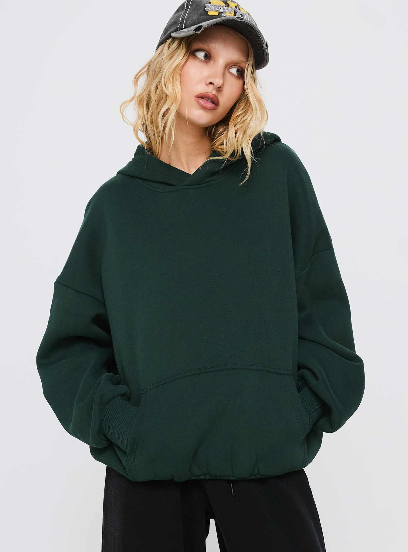 front view of model wearing Princess Polly Good Luck Graphic Hoodie Green / Blue Long 