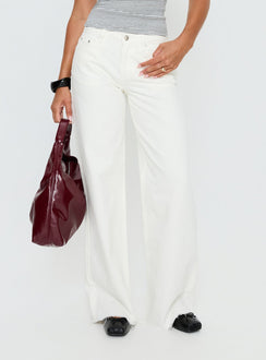 side view of model wearing Princess Polly Darla Low Rise Straight Leg Jean White Low Rise Jeans 