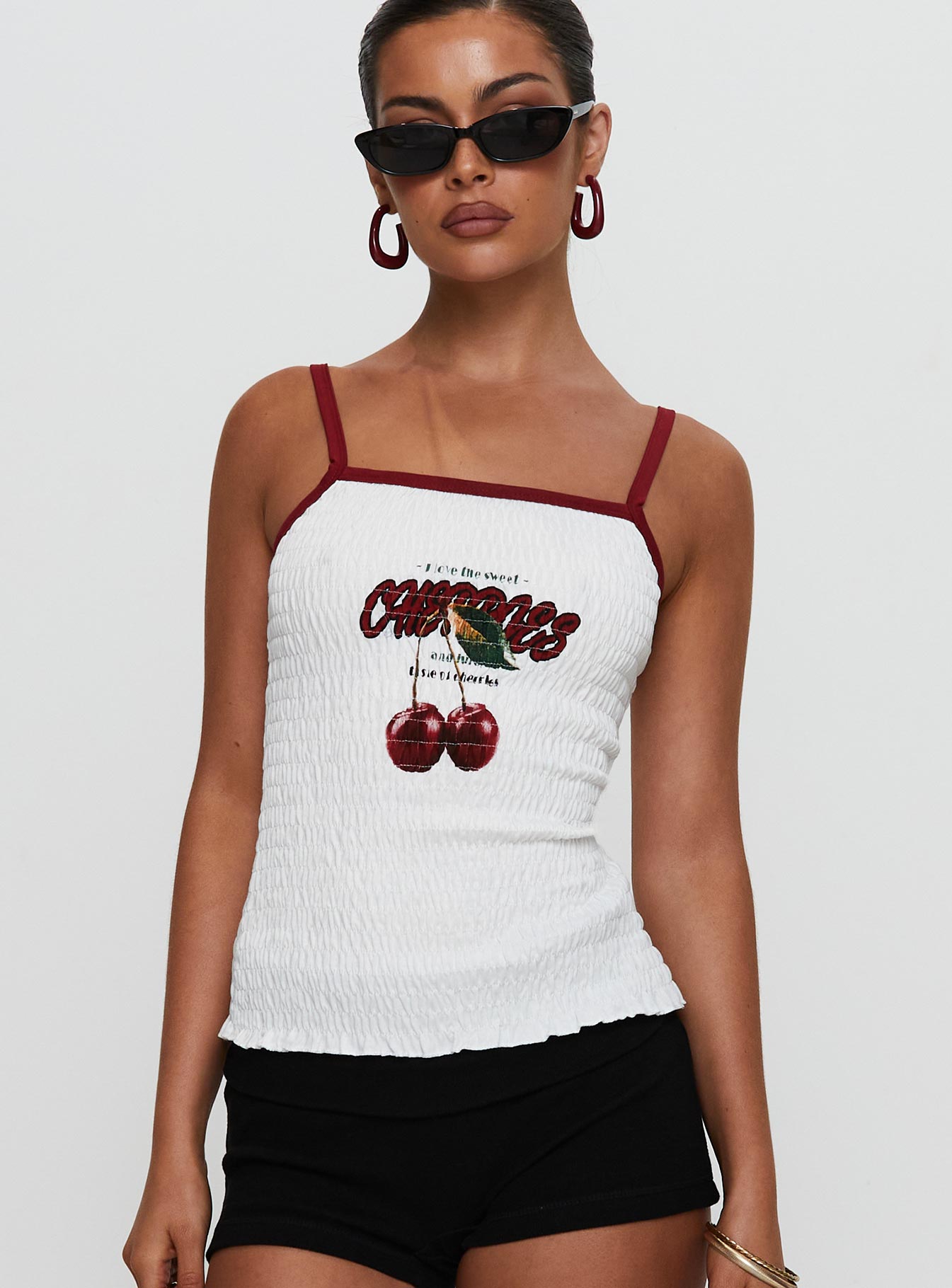 front view of model wearing Princess Polly Cherrie Ties Shirred Graphic Top White Sleeveless Square Neck 