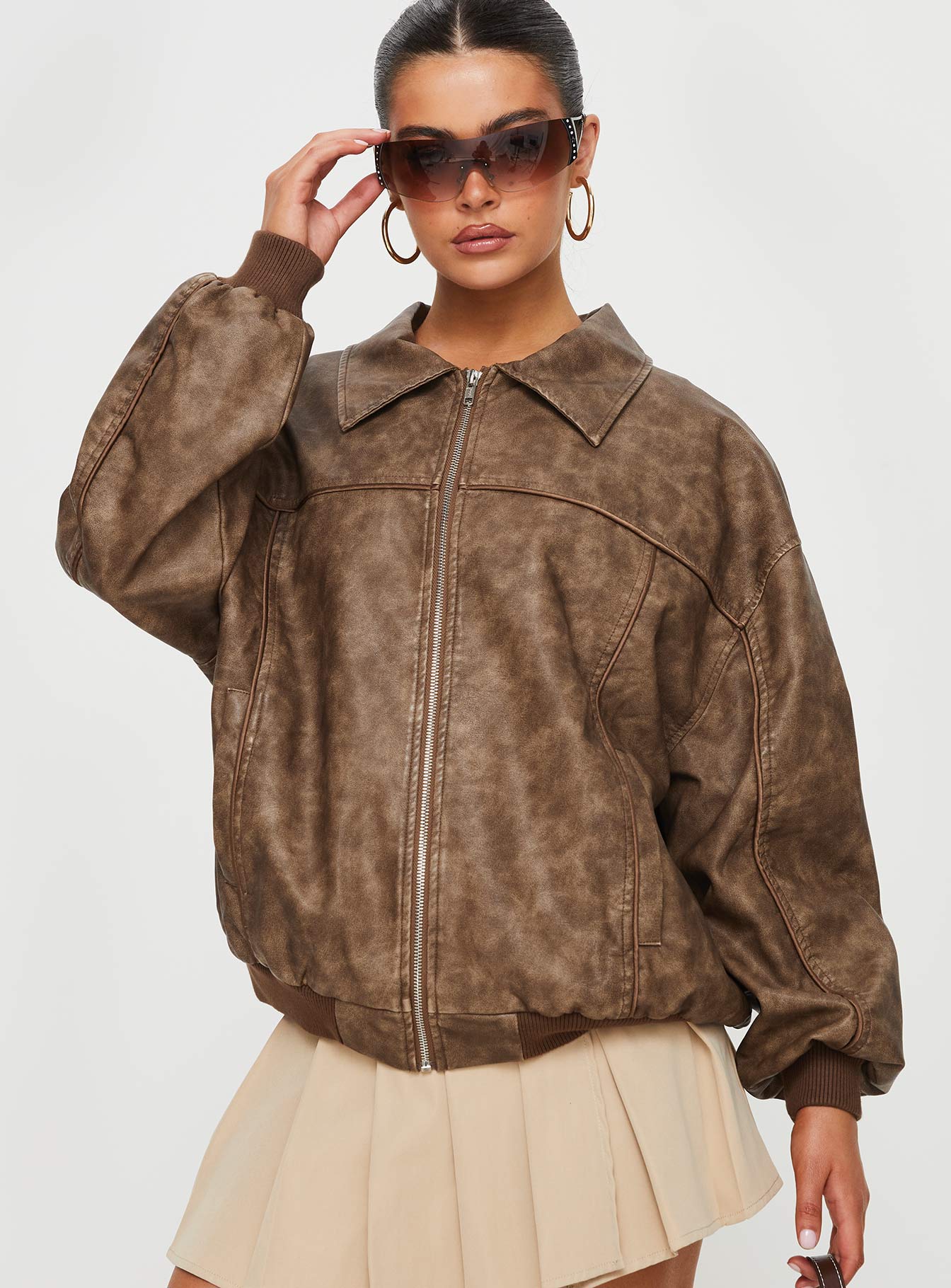 Bomber jacket  Faux leather material, oversized fit, classic collar, ribbed waistband and cuffs  Zip front fastening, twin hip pockets 