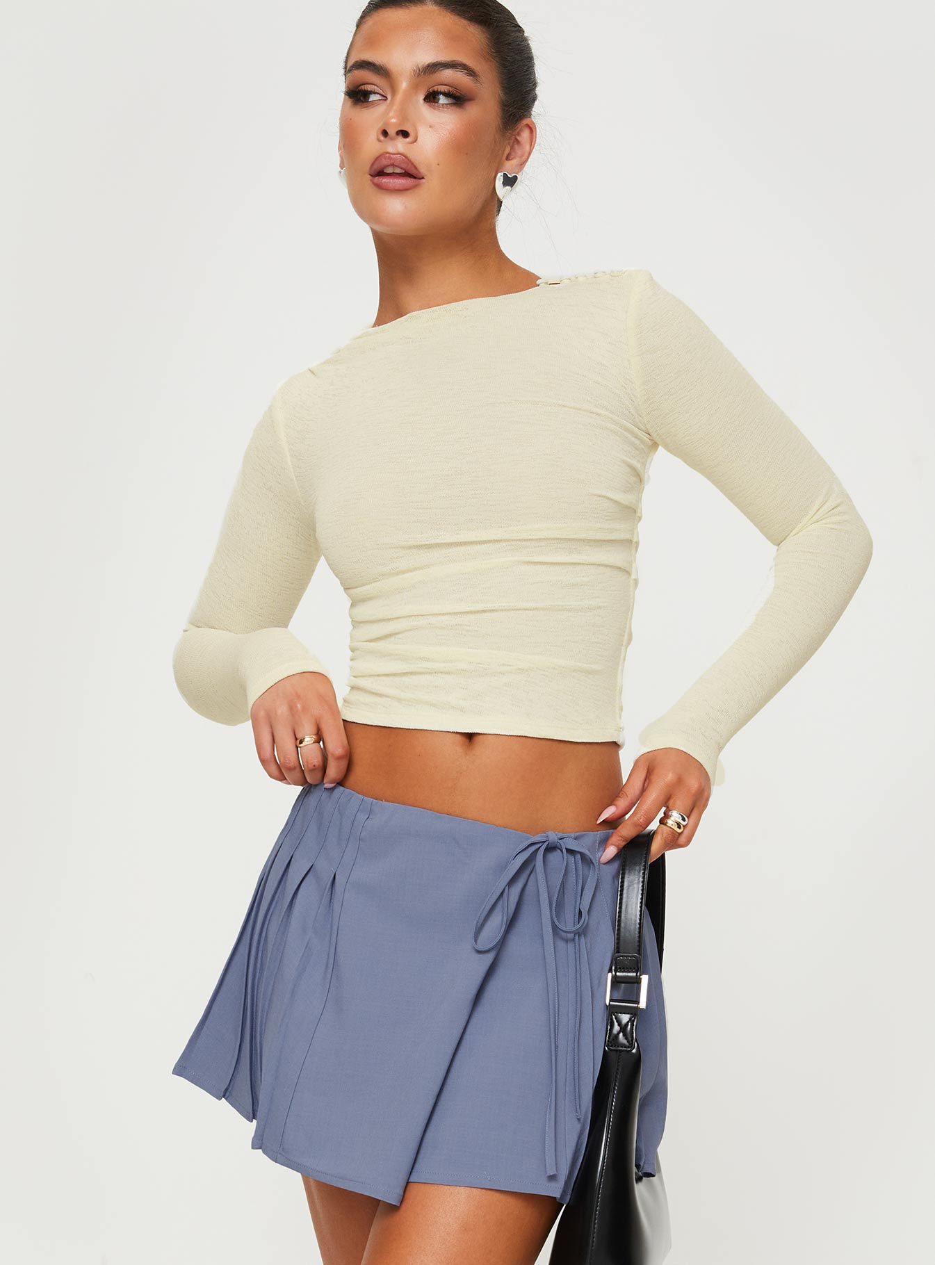 side view of model wearing Princess Polly Luvinia Long Sleeve Top Cream Full Sleeves Crew Neck 