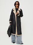 Longline coat Lapel collar, long sleeves, shearling cuffs & detail, single button fastening at cuff, twin hip pockets, double-breasted front 