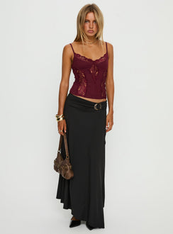   side view of model wearing Princess Polly Nola Hardware Slit Maxi Skirt Black 