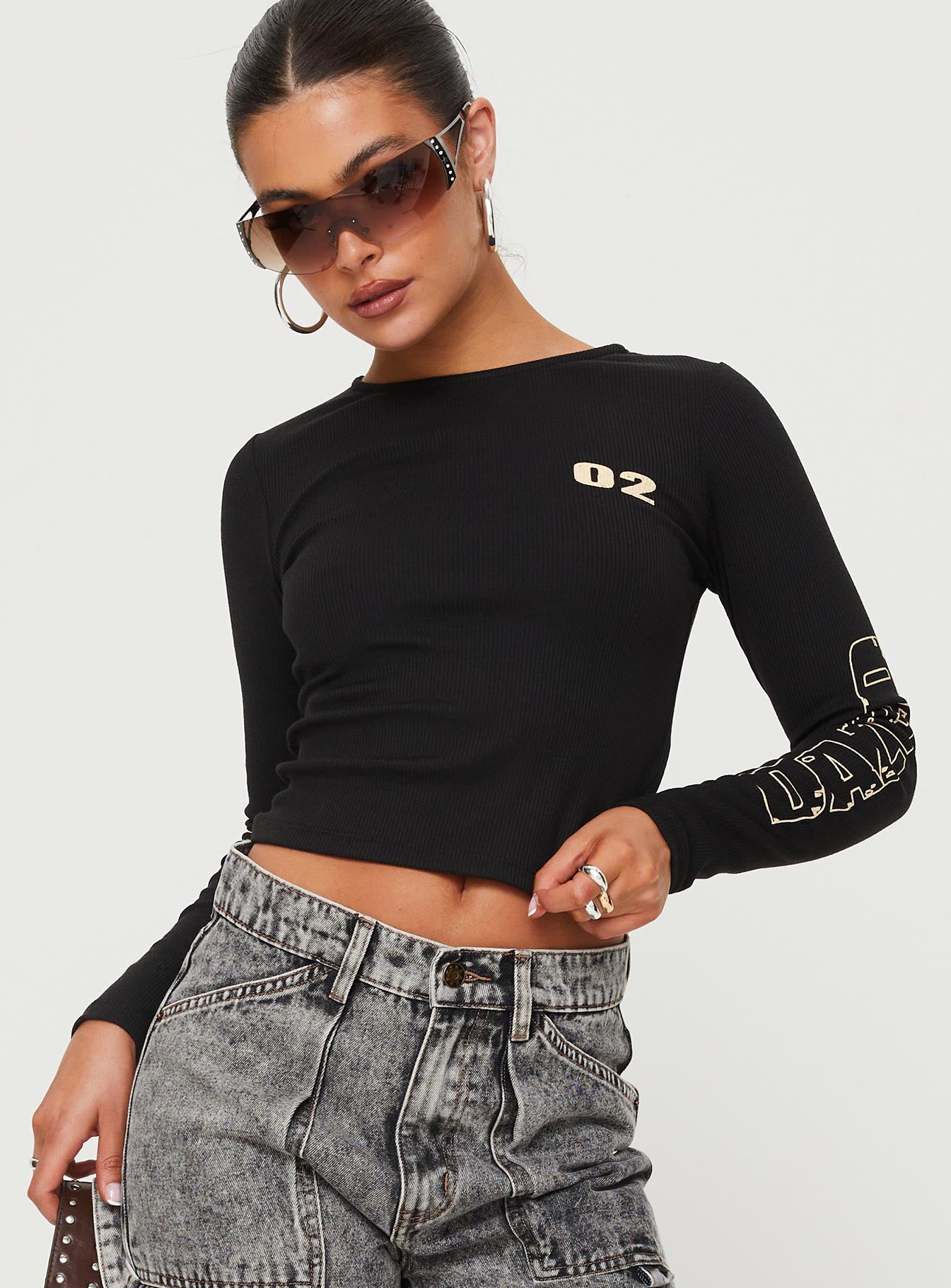 Front view of model wearing  front Princess Polly Full Sleeves High Neck  Larva 02 Long Sleeve Top Black