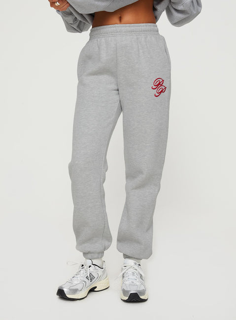 front view of model wearing Princess Polly Princess Polly Track Pants Cursive Text Grey Marle/ Red High Waisted Pants 