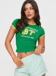 front view of model wearing Princess Polly Californian Girl Tee Green / Yellow Short Sleeves Crew Neck 