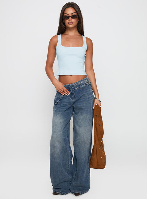 front view of model wearing Princess Polly Paltrow Mid Rise Wide Leg Cargo Jeans Mid Blue Wash Petite Mid Rise Jeans 