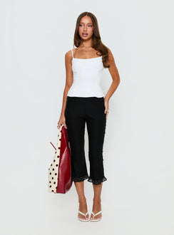 front view of model wearing Princess Polly Darsie Frill Capri Black Polka Dot High Rise Pants 