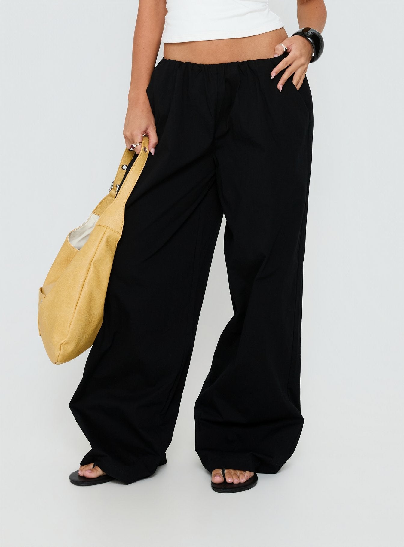 front view of model wearing Princess Polly Lunea Concealed Waistband Pants Black Low Rise Pants 