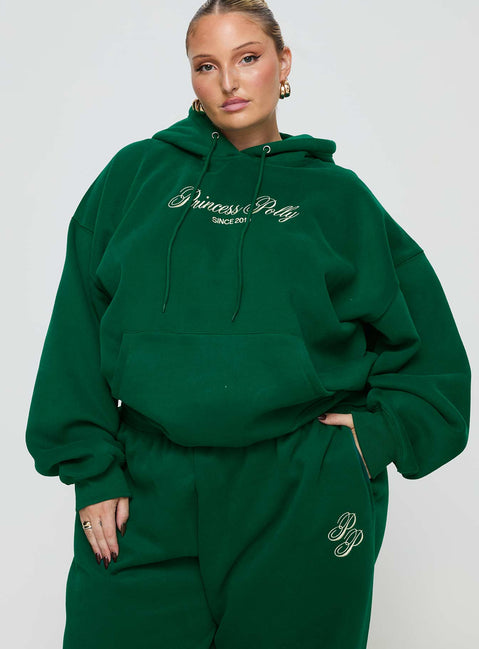 front view of model wearing Princess Polly Princess Polly Hooded Sweatshirt Script Green / Ivory Curve 