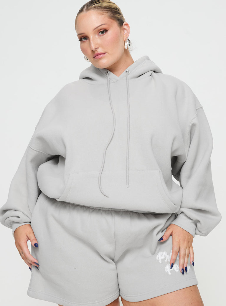 front view of model wearing Princess Polly Princess Polly Hooded Sweatshirt Puff Text Grey Curve 