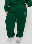 front view of model wearing Princess Polly Princess Polly Track Pants Script Green / Ivory Curve High Waisted Pants 