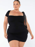 Front view of model wearing  front Princess Polly Square Neck  Nolan Short Sleeve Mini Dress Black Curve