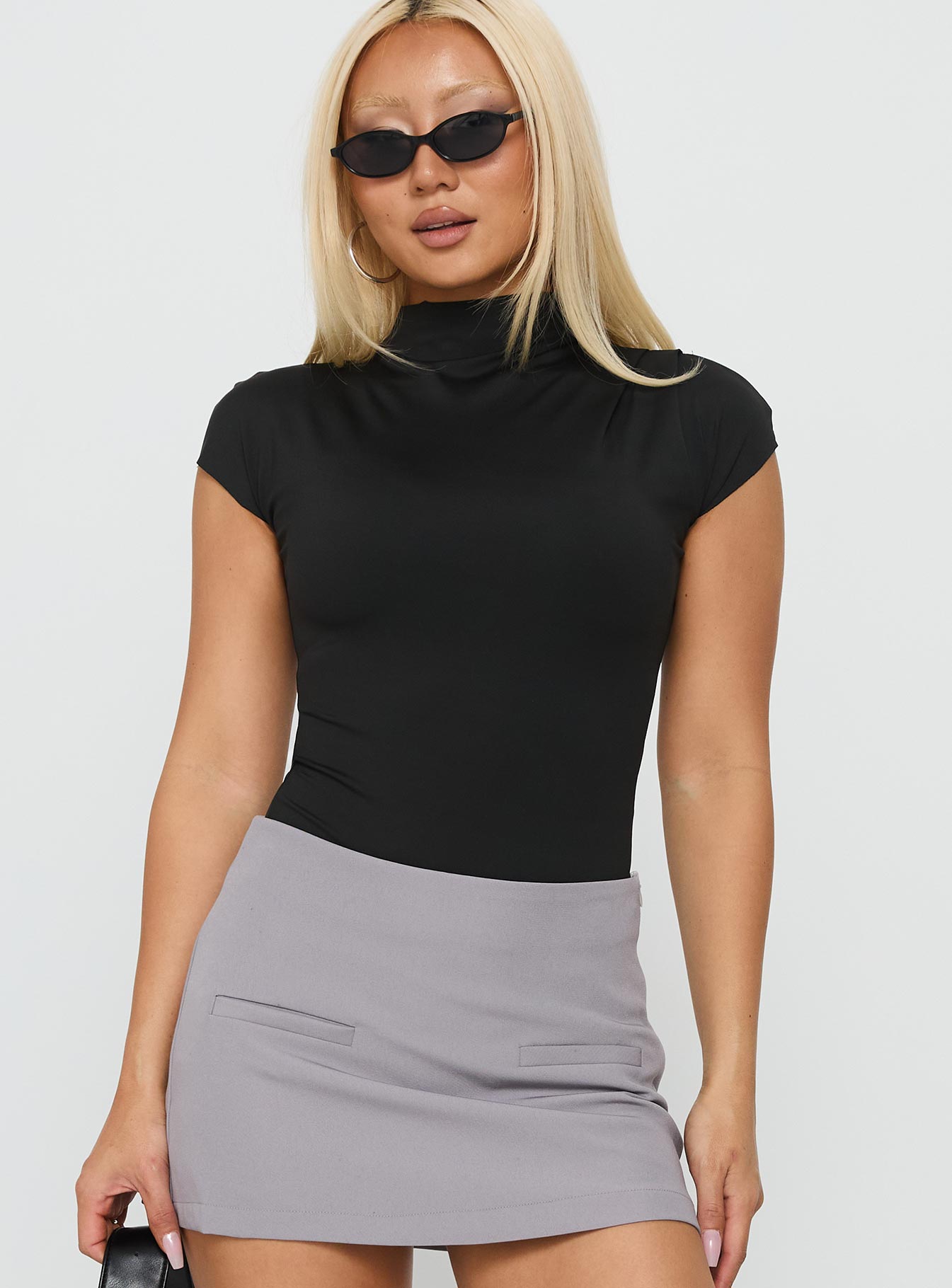 front view of model wearing Princess Polly Cailie Mock Neck Bodysuit Black Short Sleeve 