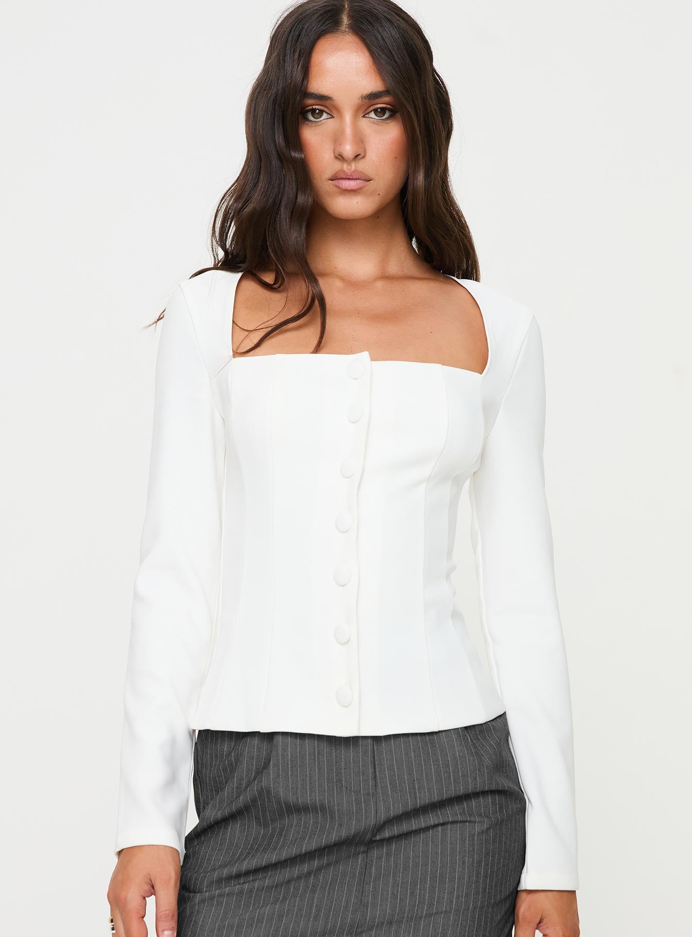 front view of model wearing Princess Polly Gaskin Long Sleeve Top White Full Sleeves Square Neck 