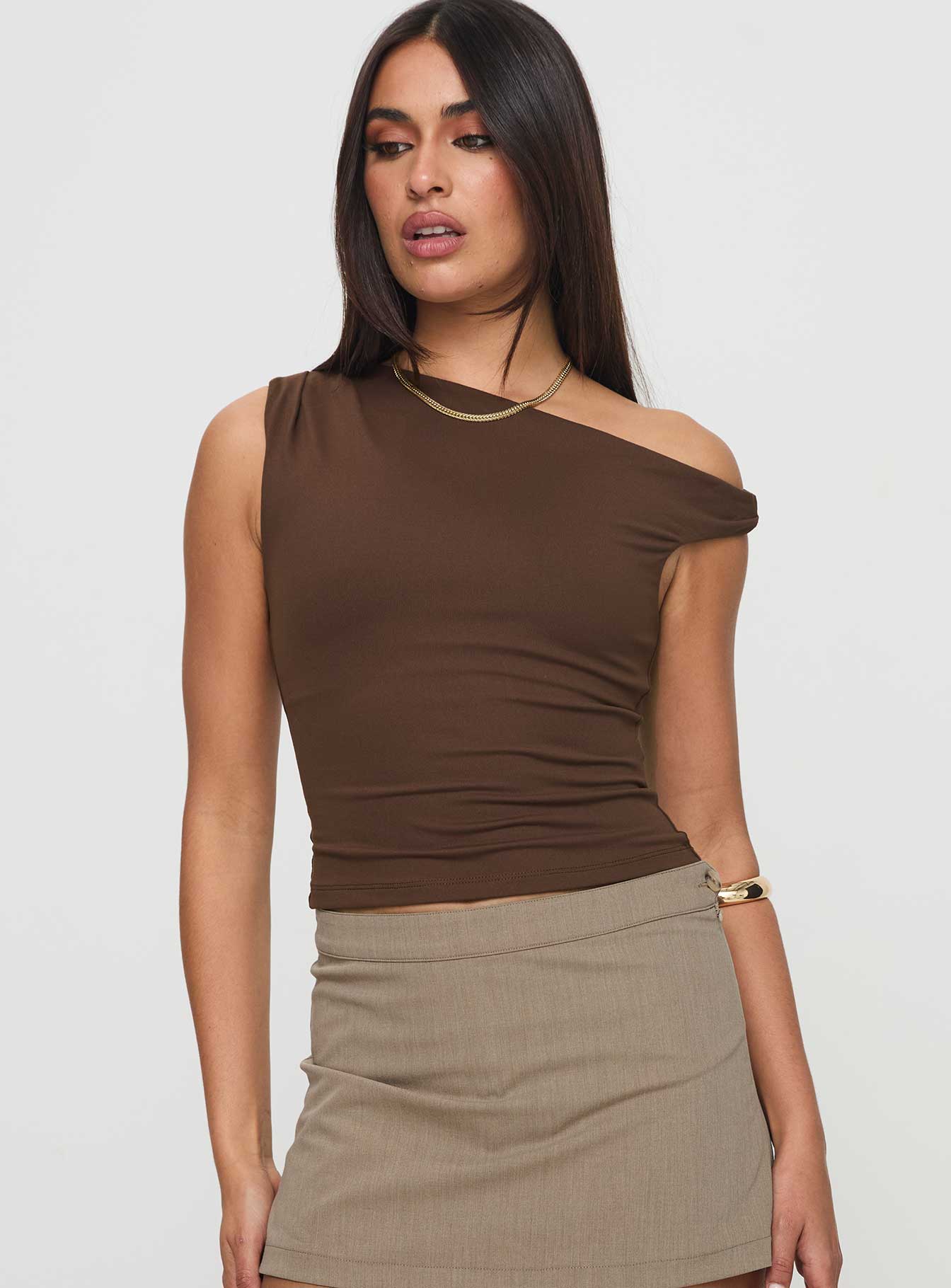 front view of model wearing Princess Polly Danza Top Brown Sleeveless Asymmetric Neckline 
