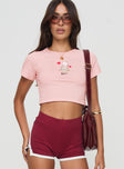 front view of model wearing Princess Polly Kewpie Little Tea Cup Baby Tee Pink Short Sleeves Crew Neck 