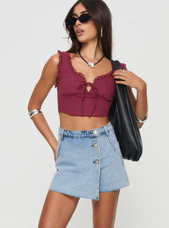 side view of model wearing Princess Polly Josue Denim Wrap Skort Light Blue Wash High Waisted Shorts 