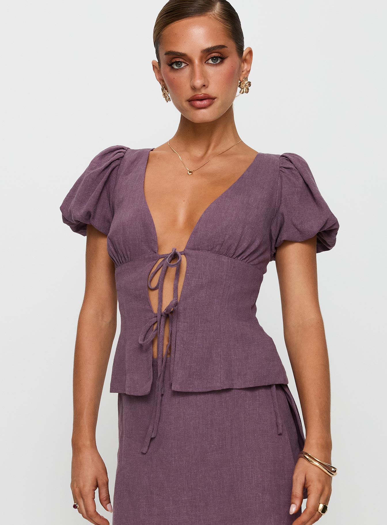 front view of model wearing Princess Polly Wilhelmina Blouse Top Mauve Short Sleeves Plunger 