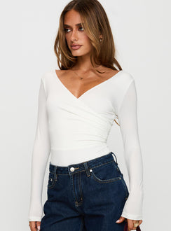 side view of model wearing Princess Polly Right Here Cross Detail Bodysuit White Long Sleeve Tops 