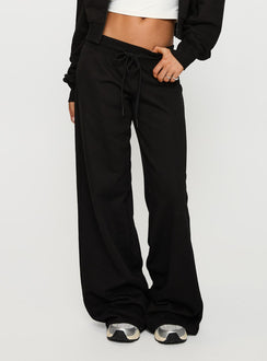 front view of model wearing Princess Polly Mindful Low Rise Pant Black Low Rise Pants 