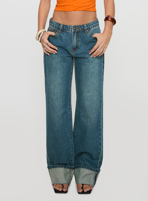 front view of model wearing Princess Polly Toros Mid Rise Wide Leg Foldover Denim Jeans Mid Blue Low Rise Jeans 